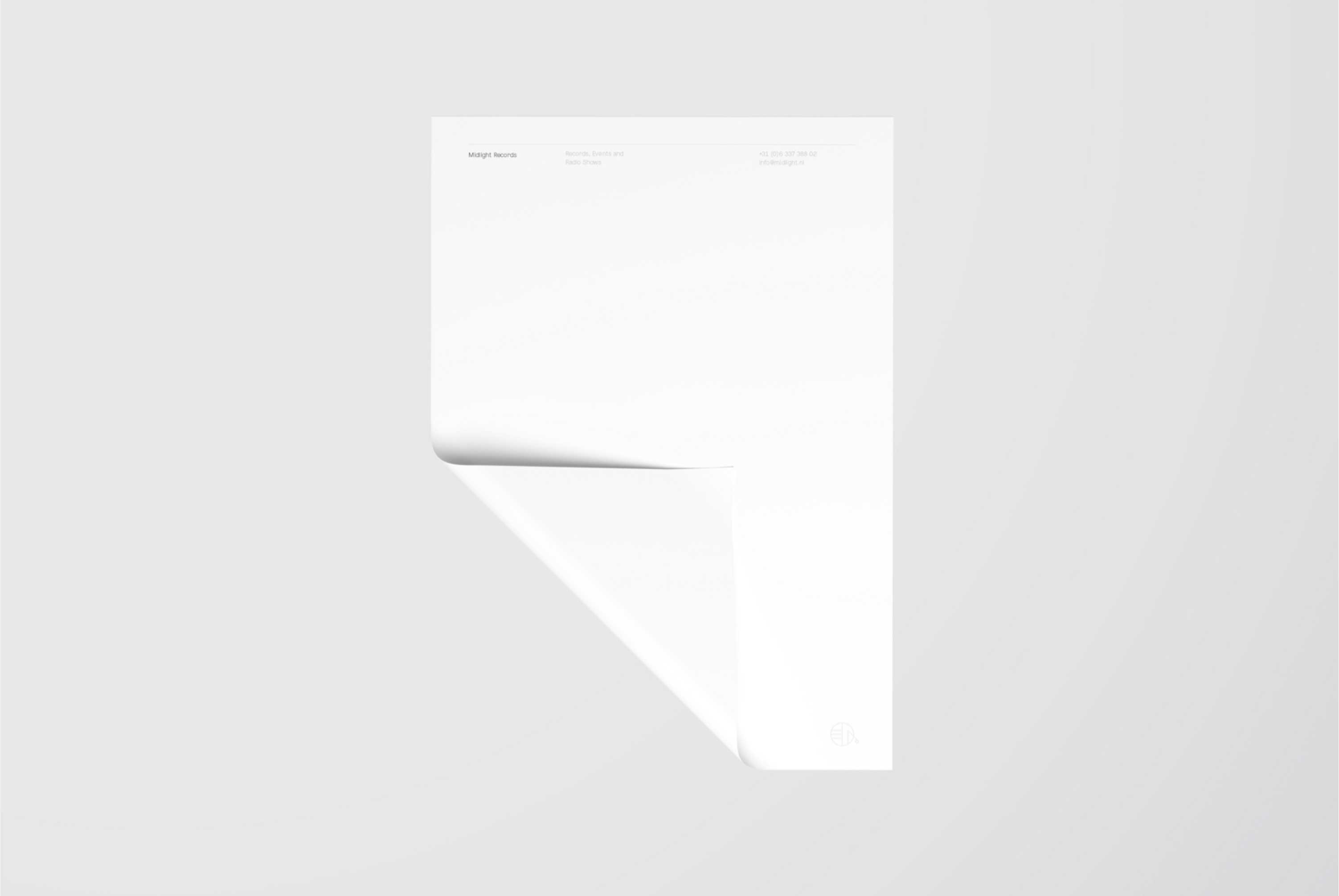 Midlight stationary with a folded corner on a grey background