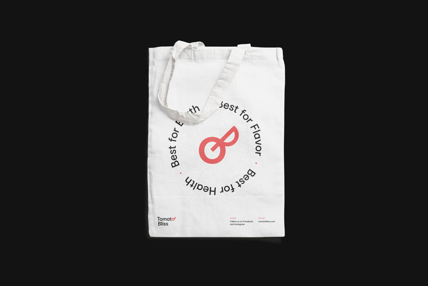 A tote-bag with Tomato Bliss logo and tagline printed on it