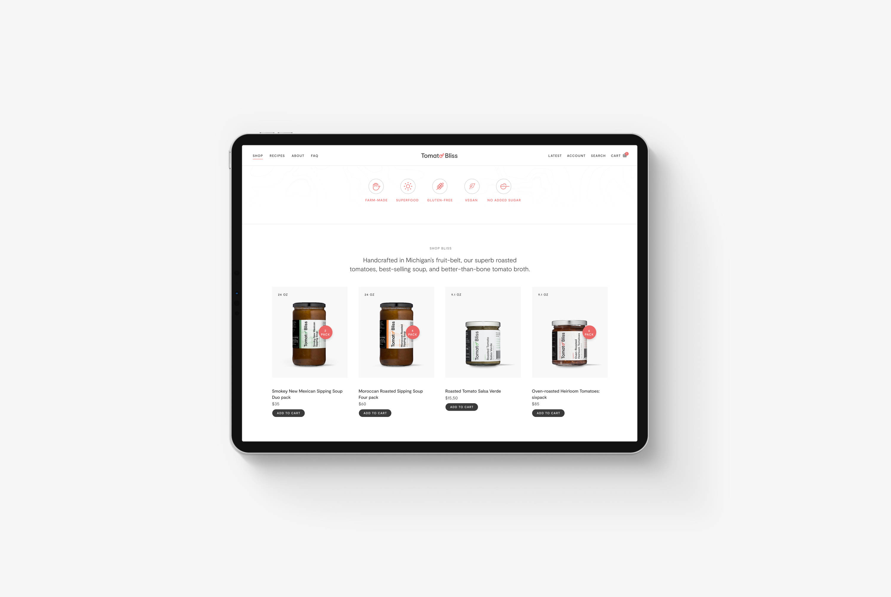 A tablet on a grey background displaying Tomato Bliss' webshop homepage product section
